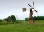 Farm with wind driven water pump near Poland - Lithuania border